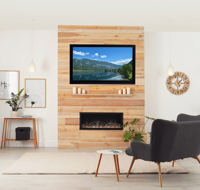 Modern living room featuring a wooden wall, TV, fireplace, and stylish furniture.