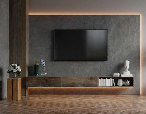 Bespoke fitted living room unit with a television and decorative elements.