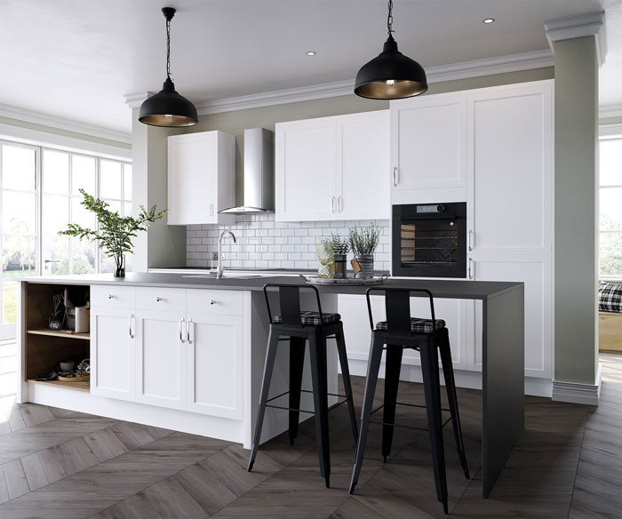 A light fitted kitchen with white tiles and cupboards
