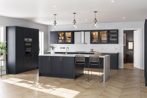 A fitted kitchen with large cabinets and wooden floors