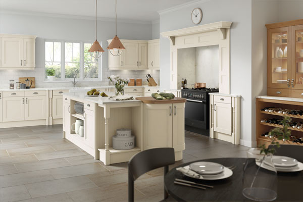 A light traditional fitted kitchen with wooden cabinets