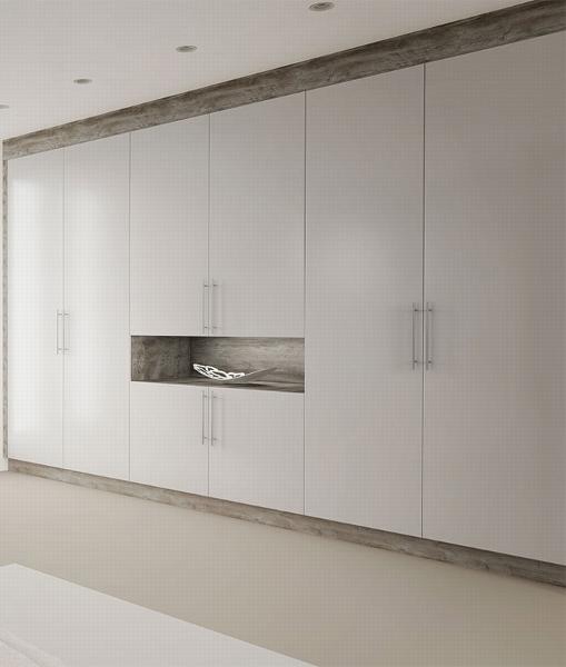 A white fitted wardrobe with multiple doors