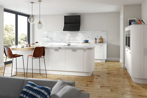 A bright kitchen with a rounded kitchen island