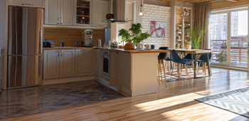 A kitchen with different flooring to break up the space