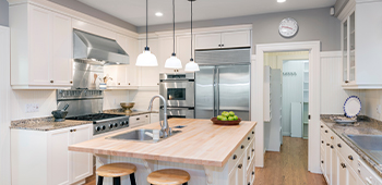 A kitchen with cream cabinets