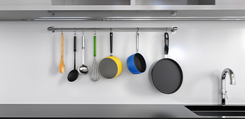 pots and pans on hooks in a kitchen