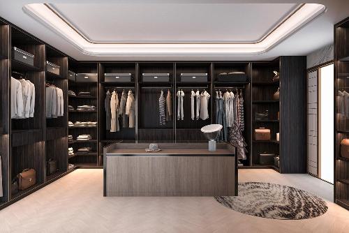A modern walk in wardrobe with dark wood and beige accents