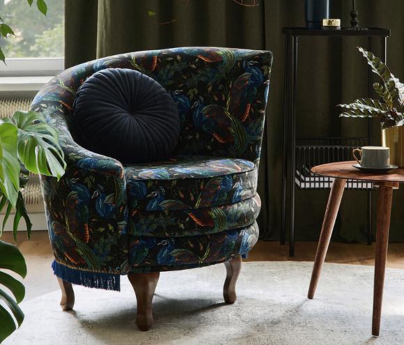 custom fabric upholstered wing chair with blue cushion